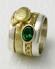 'Stacking Ring' in slver and gold with Tsavorite stone and Turtle motif in Gold.